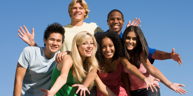 Group of six friends having fun outside